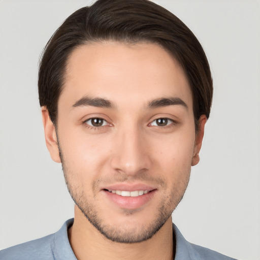 Joyful white young-adult male with short  brown hair and brown eyes