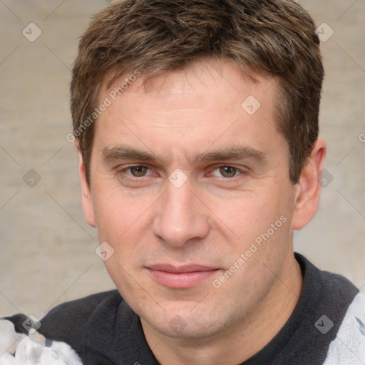 Joyful white adult male with short  brown hair and brown eyes