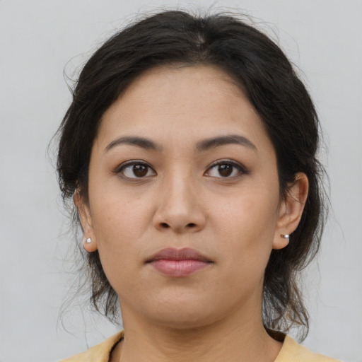 Neutral latino young-adult female with medium  brown hair and brown eyes