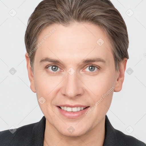 Joyful white adult male with short  brown hair and grey eyes