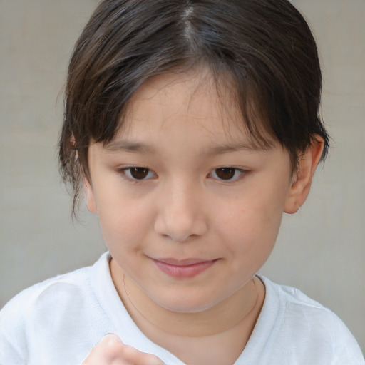 Joyful white child female with short  brown hair and brown eyes