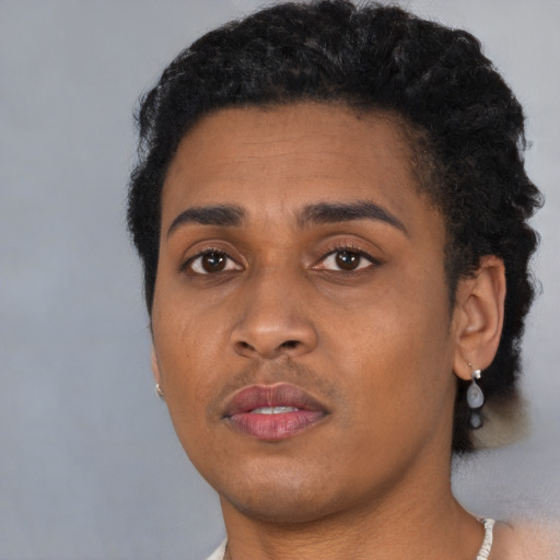 Neutral black young-adult female with short  black hair and brown eyes