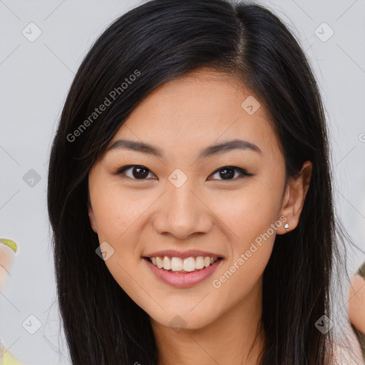 Joyful asian young-adult female with long  brown hair and brown eyes