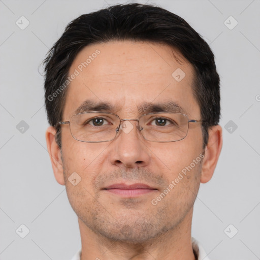 Joyful white adult male with short  brown hair and brown eyes