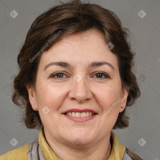 Joyful white adult female with medium  brown hair and brown eyes