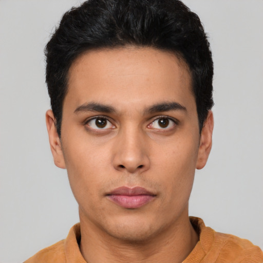 Neutral latino young-adult male with short  black hair and brown eyes