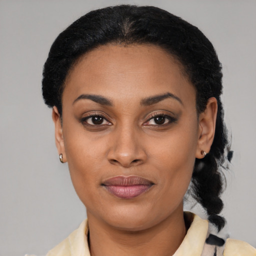 Joyful latino young-adult female with short  black hair and brown eyes