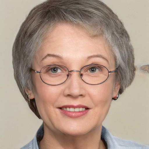 Joyful white middle-aged female with short  brown hair and grey eyes