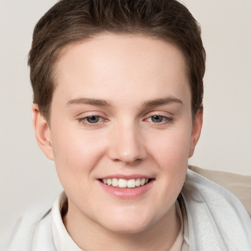 Joyful white young-adult female with short  brown hair and grey eyes