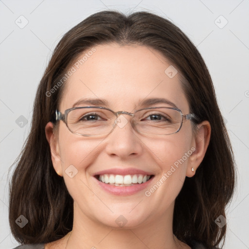 Joyful white adult female with medium  brown hair and grey eyes