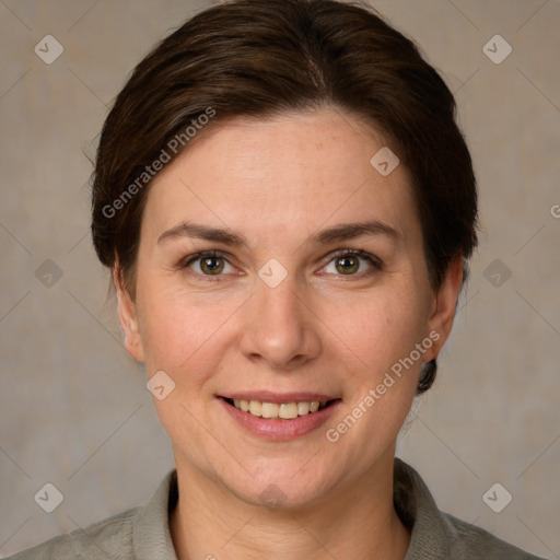 Joyful white adult female with short  brown hair and grey eyes