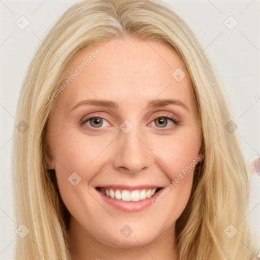 Joyful white young-adult female with long  brown hair and blue eyes