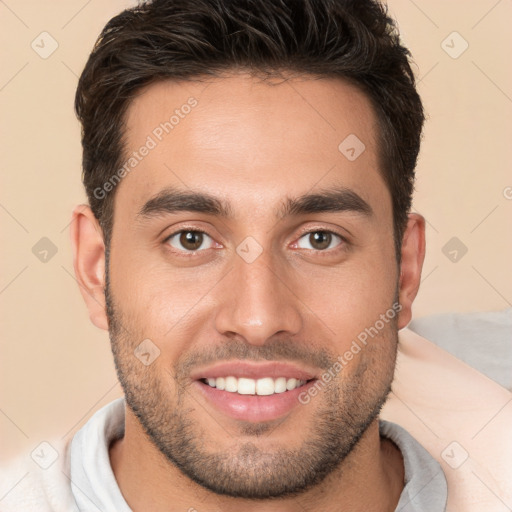 Joyful white young-adult male with short  brown hair and brown eyes