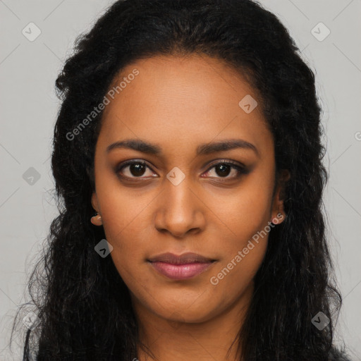 Joyful black young-adult female with long  black hair and brown eyes