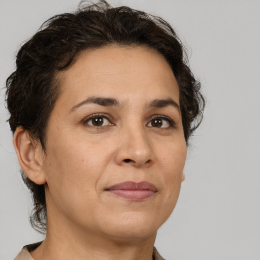 Joyful white adult female with short  brown hair and brown eyes
