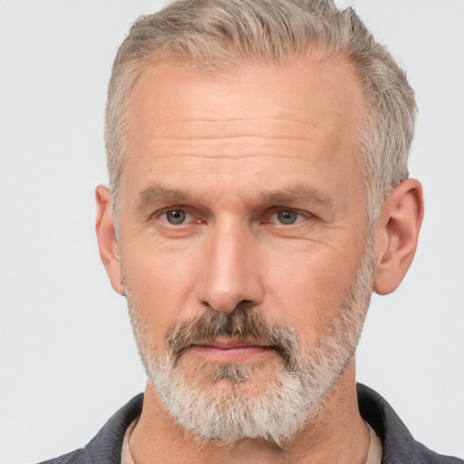 Neutral white middle-aged male with short  gray hair and brown eyes