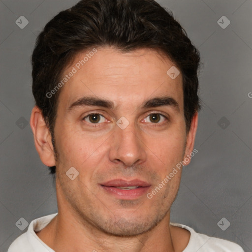 Joyful white adult male with short  brown hair and brown eyes