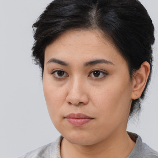 Neutral asian young-adult female with medium  brown hair and brown eyes