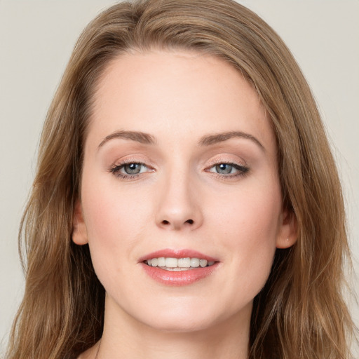 Joyful white young-adult female with long  brown hair and grey eyes