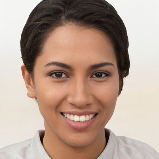 Joyful white young-adult female with short  brown hair and brown eyes