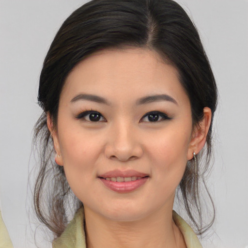 Joyful white young-adult female with medium  brown hair and brown eyes