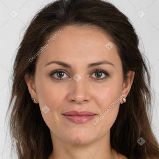 Joyful white adult female with long  brown hair and brown eyes