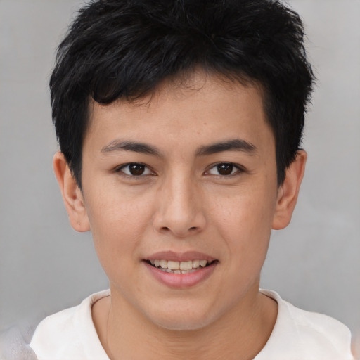 Joyful asian young-adult male with short  brown hair and brown eyes