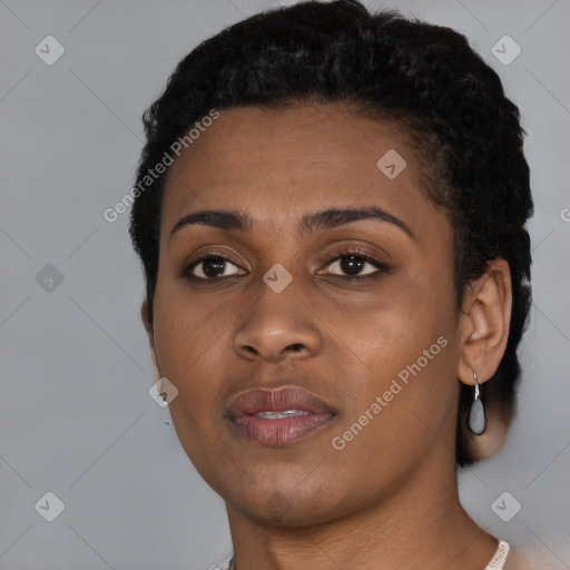 Joyful black young-adult female with short  black hair and brown eyes
