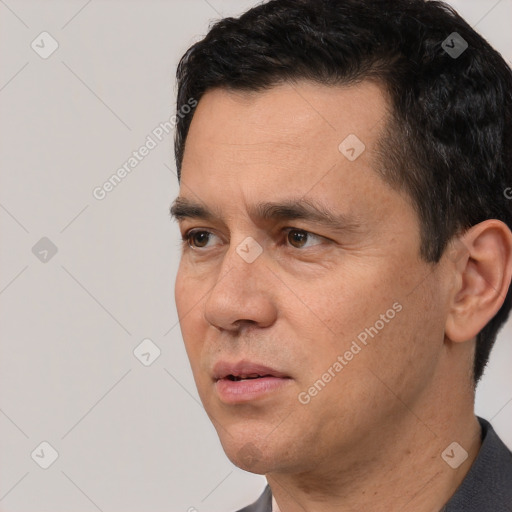 Neutral white adult male with short  black hair and brown eyes