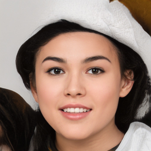 Joyful white young-adult female with medium  black hair and brown eyes