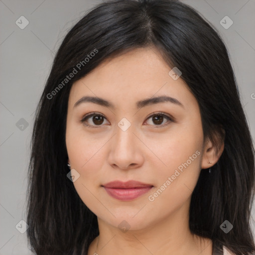 Joyful asian young-adult female with long  brown hair and brown eyes