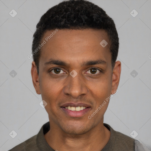 Joyful black young-adult male with short  black hair and brown eyes