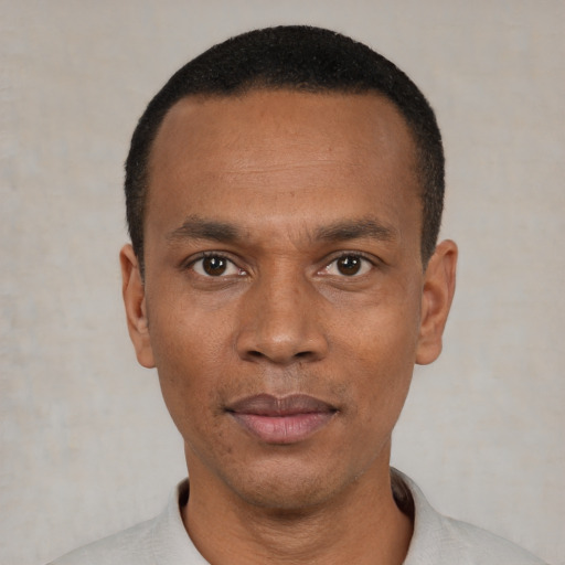 Neutral black young-adult male with short  black hair and brown eyes