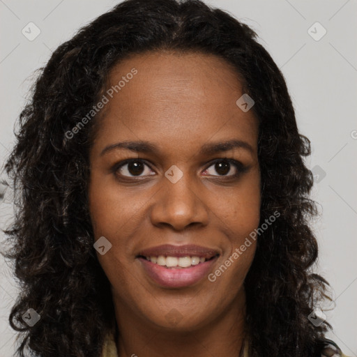 Joyful black young-adult female with long  brown hair and brown eyes