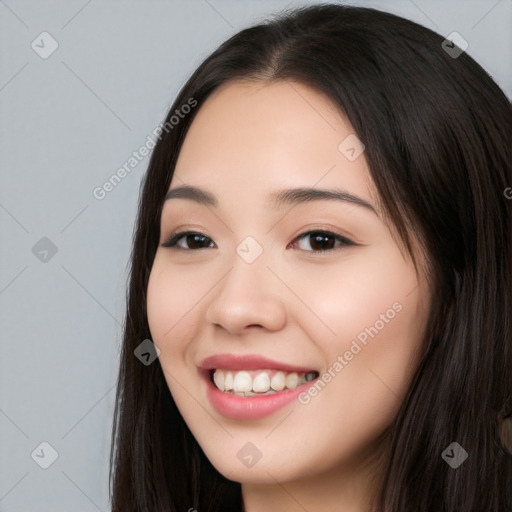 Joyful white young-adult female with long  black hair and brown eyes