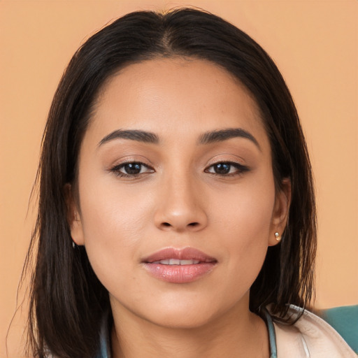 Joyful asian young-adult female with long  brown hair and brown eyes