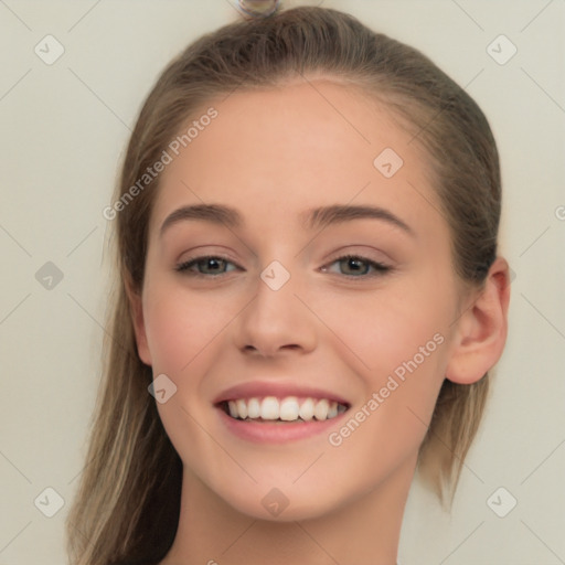 Joyful white young-adult female with long  brown hair and grey eyes