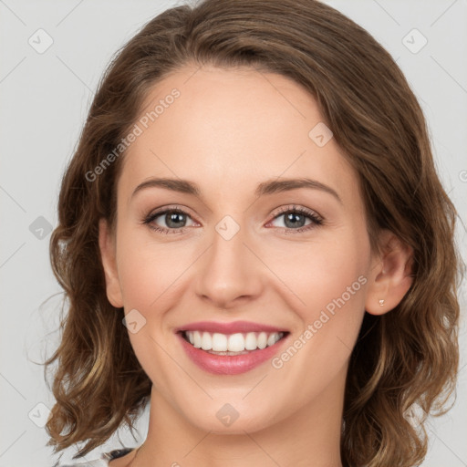 Joyful white young-adult female with medium  brown hair and green eyes