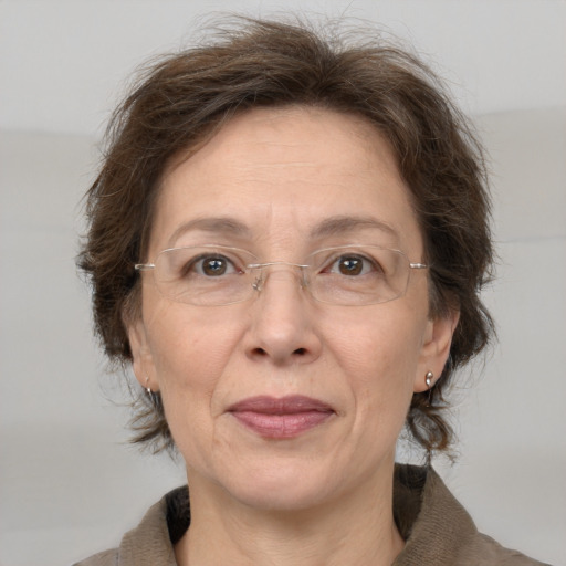 Joyful white middle-aged female with medium  brown hair and brown eyes