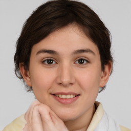 Joyful white young-adult female with medium  brown hair and brown eyes