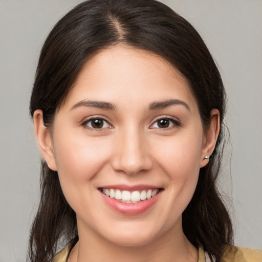 Joyful white young-adult female with medium  brown hair and brown eyes