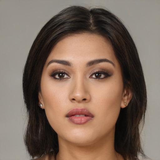 Neutral asian young-adult female with long  brown hair and brown eyes