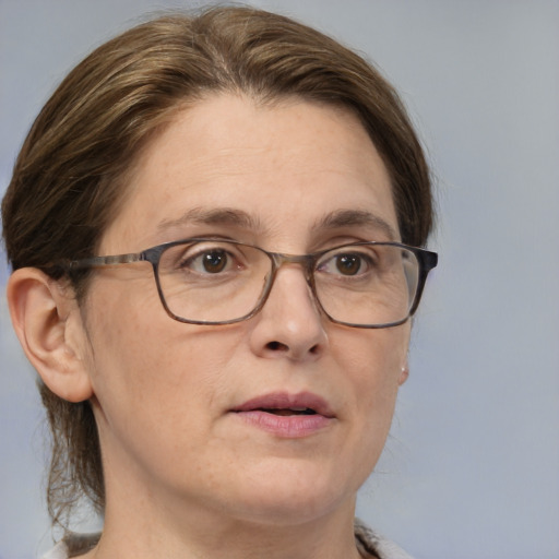 Joyful white adult female with medium  brown hair and brown eyes