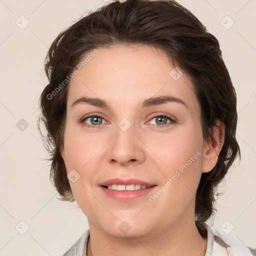 Joyful white young-adult female with medium  brown hair and green eyes