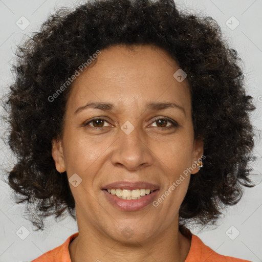 Joyful black adult female with medium  brown hair and brown eyes