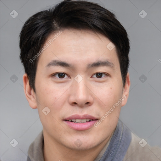 Joyful asian young-adult male with short  brown hair and brown eyes
