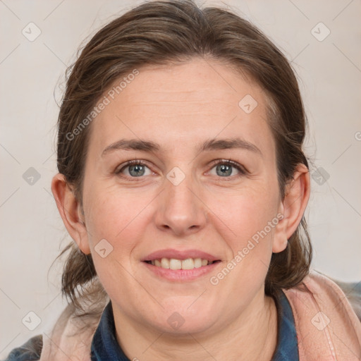 Joyful white adult female with medium  brown hair and grey eyes