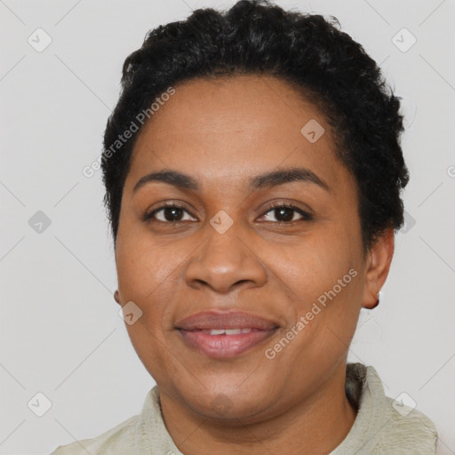 Joyful black adult female with short  brown hair and brown eyes