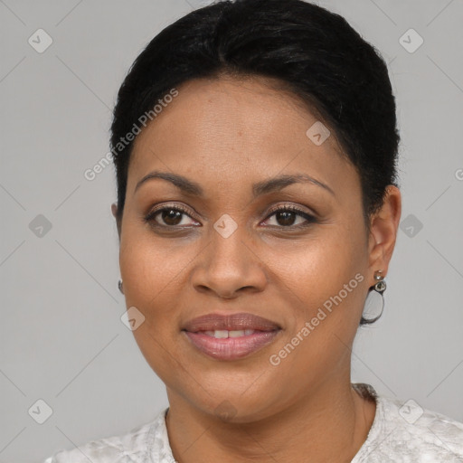 Joyful latino young-adult female with short  black hair and brown eyes