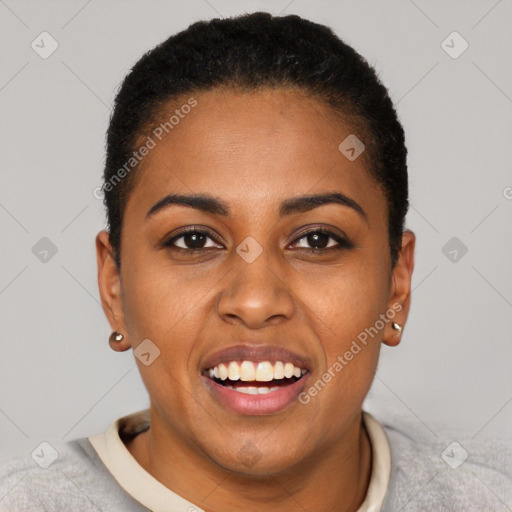 Joyful black young-adult female with short  black hair and brown eyes